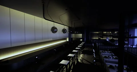 Chic modern restaurant interior with ambient lighting and sleek design Stock Footage 313634453