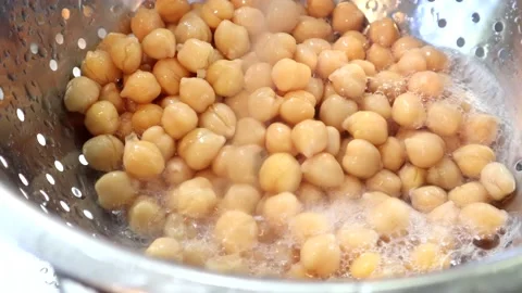 Chic Peas Being Rinsed Under A Tap In A Colander 스톡 동영상 138043719