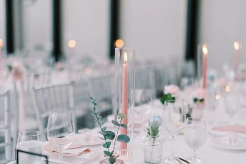 Chic setting with candles and flowers. Refined evening ambiance with soft 스톡 사진