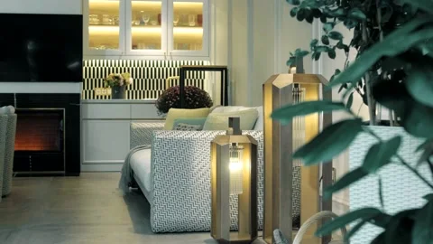 Chic summer kitchen with stylish brass floor lamps in the garden Stock Footage 165988050