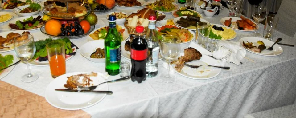 The chic table is covered with a white tablecloth on which there are various Stock Photos