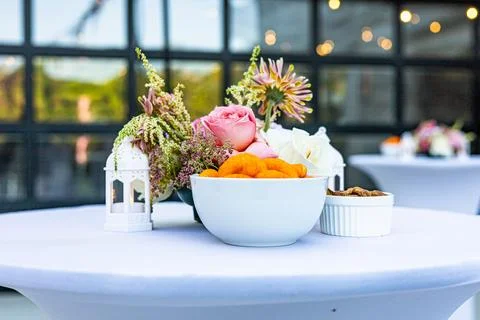 Chic Table Decor with Cheese Puffs and Almonds Stock Photos