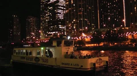 CHICAGO-0666 NIGHT SCENE ON THE RIVER WITH WATER TAXI Vídeo Stock 10807495