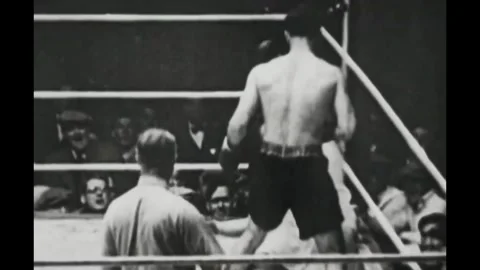 CHICAGO - 1927 - Jack Dempsey exchanges punches with Gene Tunney in slow motion Stock Footage 341987918