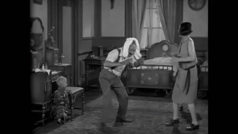 CHICAGO - 1928 - In this silent comedy, Amos sends his family out after his Stock Footage 323259251