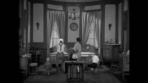 CHICAGO - 1928 - In this silent comedy, Amos suffers a toothache as his family Stock Footage 323259955