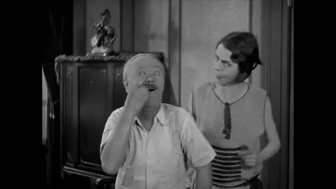 CHICAGO - 1928 - In this silent comedy, a pillow filled with items hits Amos, Stock Footage 323264012