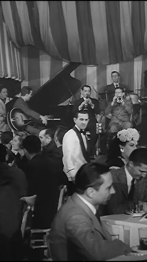 CHICAGO - 1940s - Couples on a double date enjoy the music at Eddie Condon's Stock Footage 342272551