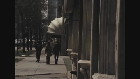 CHICAGO 1970s: Reflection in restaurant window.  People walk down city street. Stock Footage 301907192