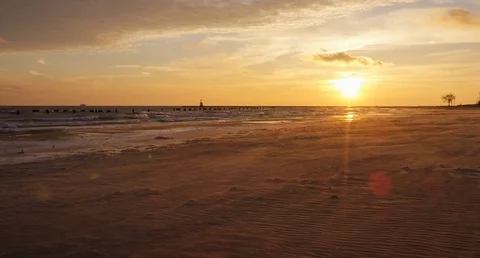 Chicago - Blowing Sand on Beach During Sunrise - 4K Slow Motion Stock Footage 83264759