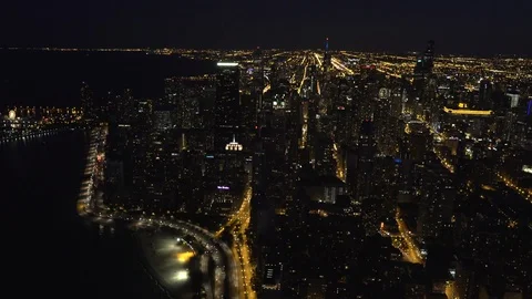 Chicago Circa-2015, wide angle aerial view of the Silhouetted Chicago Skyline at Stock Footage 98663899