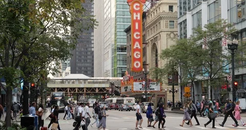 Chicago crowd of people walking crossing street near theatre Stock Footage