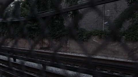 Chicago CTA Subway Rolls By Through Fence 2 Stock Footage 79019945