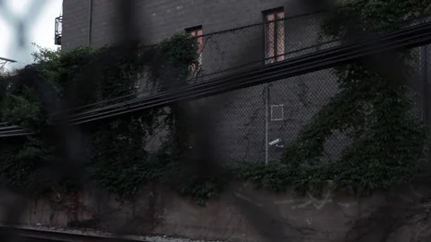 Chicago CTA Subway Rolls By Through Fence Stock Footage 79019960