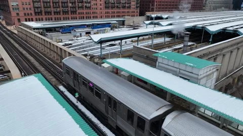 Chicago CTA Subway Train Departs From Snowy Train Station Stock Footage 345874859