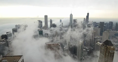 Chicago downtown skyline buildings in thick fog cloud moving Stock Footage