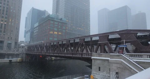 Chicago downtown snowing winter river bridge Stock Footage