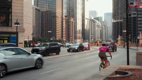 Chicago Downtown Traffic Cyclist Passing Bridge Skyline Golden Hour 60fps Stock Footage 331560154