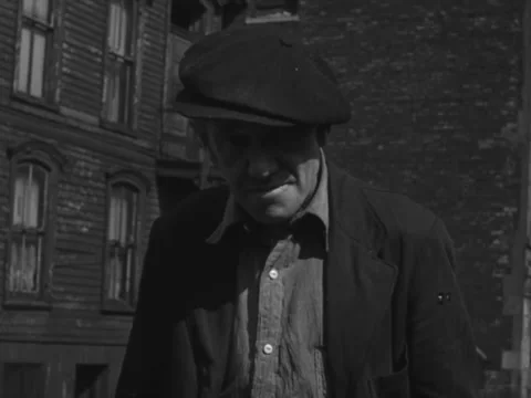 Chicago, IL - 1930s: Poor man stares into camera Stock Footage 231903245