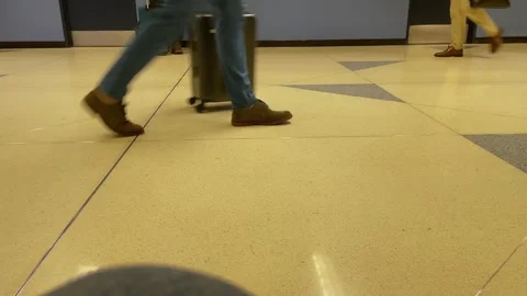 CHICAGO, IL, USA  11-3-2024 Low shot of people passing by at an airport Stock Footage 290518185
