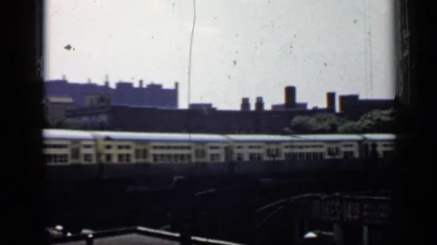 CHICAGO ILLINOIS-1958: Train Passing By Along With People Loading On The Dock Stock Footage 124936403