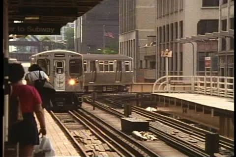 CHICAGO, ILLINOIS, 1994, Elevated train, the L, approaches from around curve Stock Footage 10917794