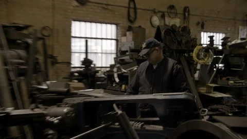 Chicago Interior Machine Works Shop Older Man Crash Zoom Stock Footage 89995937