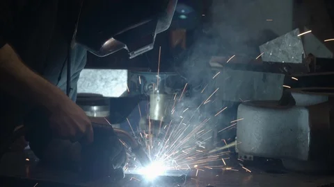 Chicago Interior Young Man Welding Tilt Down MCU Stock Footage 89998530