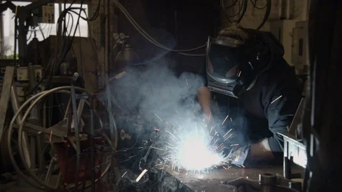 Chicago Interior Young Man Welding Wide Shot Sparks Stock Footage 89998833