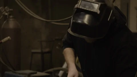 Chicago Interior YoungMan Close up to WS of Welding Stock Footage 89996892