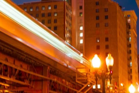 Chicago loop train motion blur long exposure of passing train overhead street Stock Photos