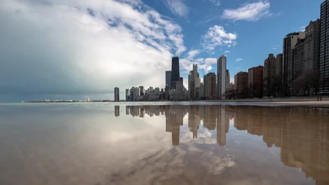 Chicago - Skyline and Clouds Reflecting in Water along Lake Shore - 4K Timelapse Stock Footage 144899131