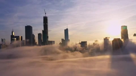 Chicago Skyline Emerging Through Dense Fog at Golden Sunset Stock Footage 342754256