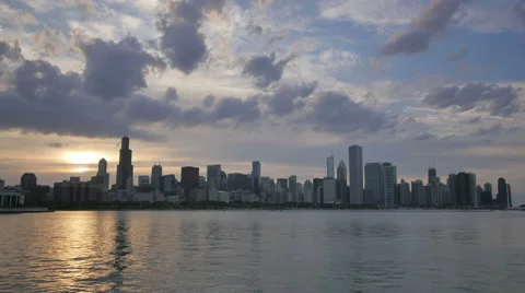 Chicago Skyline Reflected on the Lake at Sunset 스톡 동영상 64267427