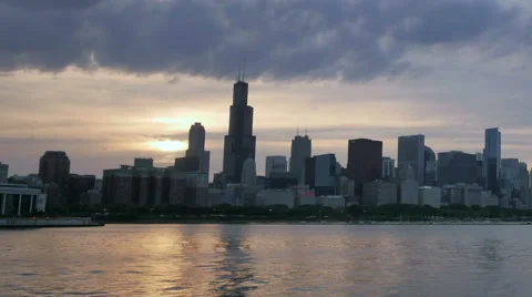 Chicago Skyline Reflected on the Lake at Sunset Hyperlapse Stock Footage 64954297