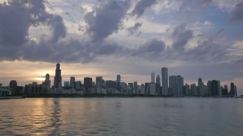 Chicago Skyline Reflected on the Lake at Sunset Video stock 80540121