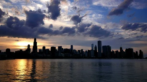 Chicago Skyline Reflected on the Lake at Sunset Stock Footage 87428704