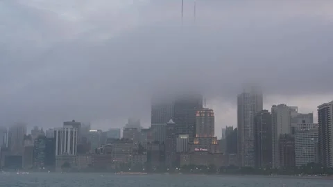 Chicago skyline with rolling fog over Lake Michigan at evening twilight Stock Footage 340819628