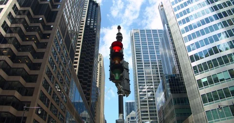 Chicago traffic light turns from red to green at downtown skyscrapers financial Stock Footage 112406611