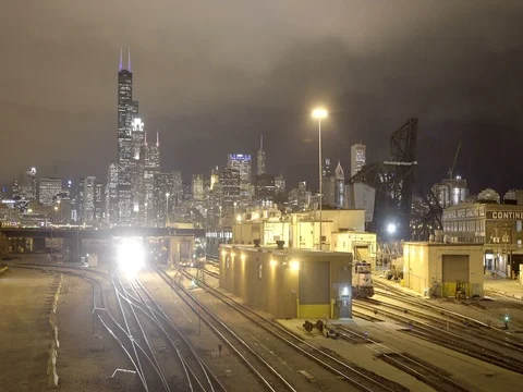 Chicago - Train Passing with Skyline in Background - 4K Stock Footage 81016837