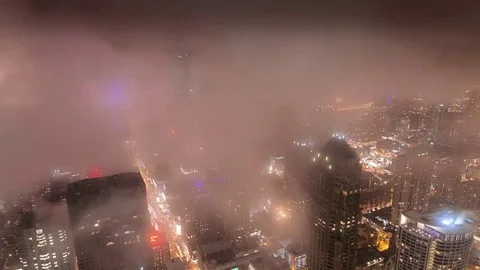 Chicago Urban Timelapse Above Clouds. City Fog at Night Stock Footage 76707616