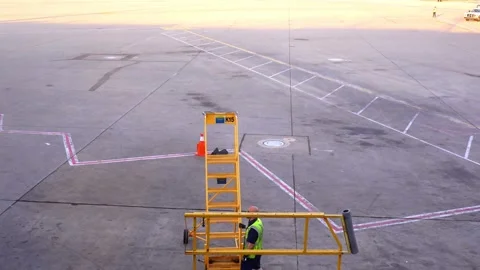Chicago, USA, 7 May 2026: Ground perspective of an airport ladder stand, Chicago Stock Footage 336339432