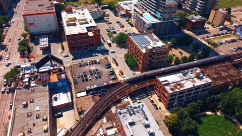 Chicago, USA, 7 May 2026: Elevated train curving over intersection in Chicago Stock Footage 336806744