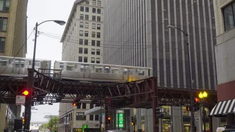 Chicago, USA - Circa 2019: loop train passing overhead busy downtown street b Stock Photos