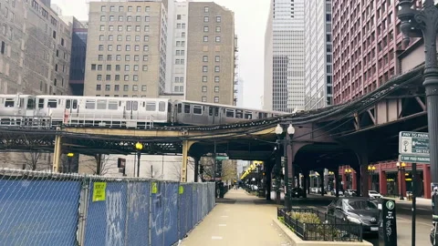 Chicago, USA - May 25, 2022 A train in downtown Chicago moving over an iron Stock-Footage 196570853