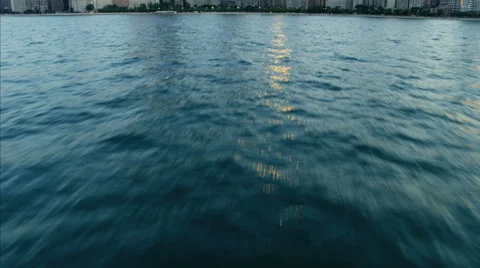 Chicago, USA - September 2016: Aerial sunlight sunset Waterfront Reveal of Lake Stock Footage
