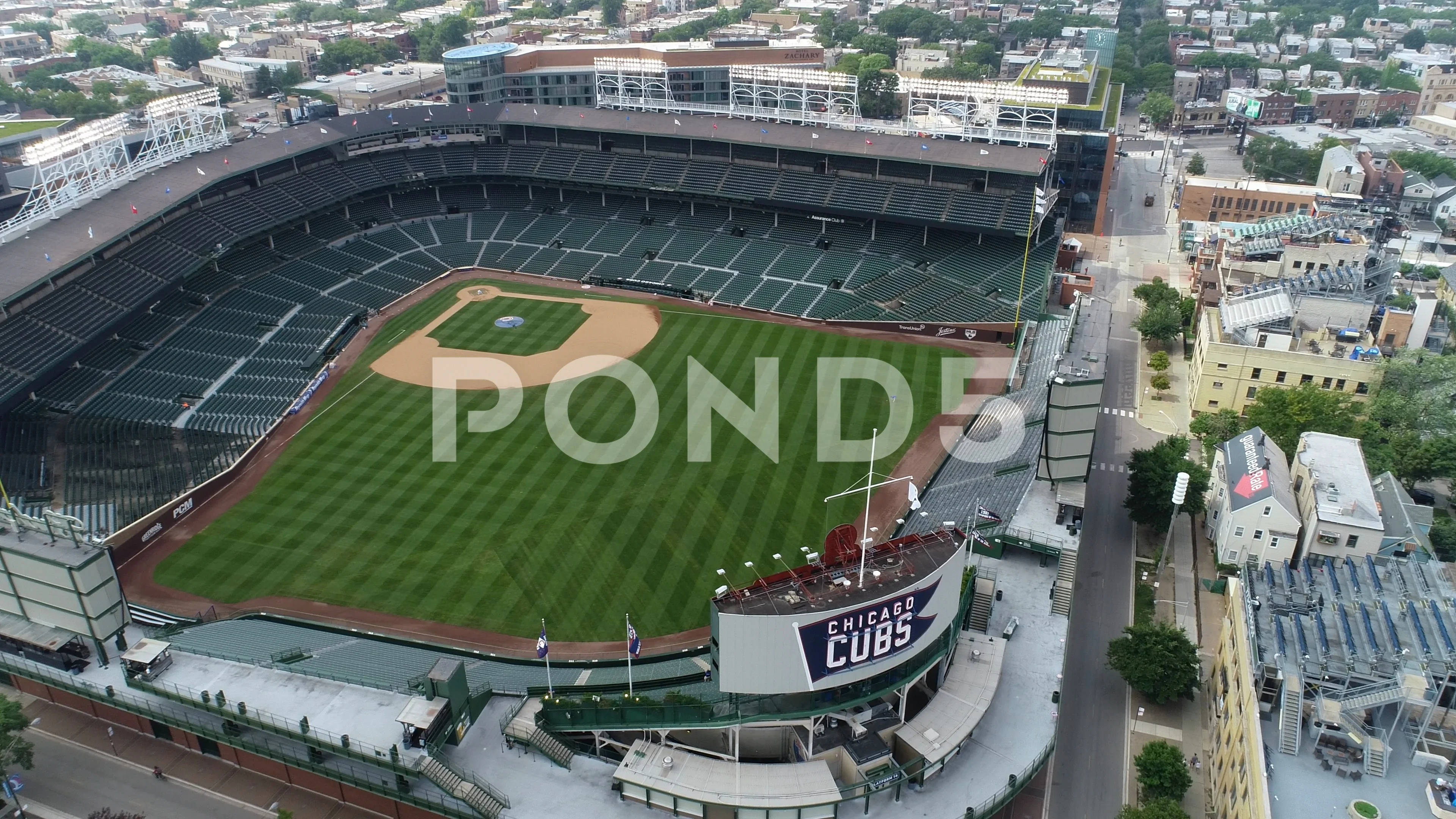 Aerial View Of Wrigley Field With Chicago, Illinois Skyline In