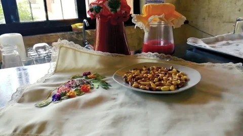Chicha morada with maize on the tablecloth Stock Footage 123620541