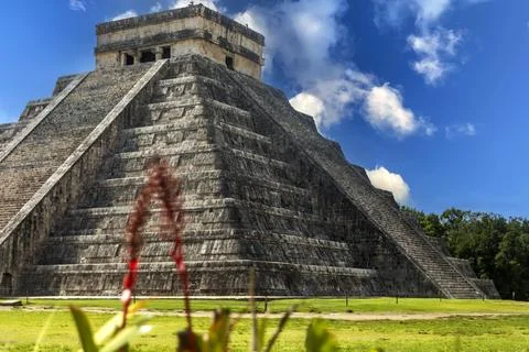 The Chichen Itza pyramid of Mexico under the blue sky is the famous castle Stock Photos