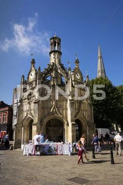 CHICHESTER, UNITED KINGDOM - AUGUST 12: People walk on street in front of the Stock Photos